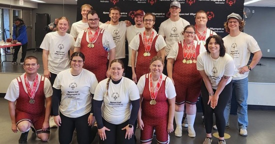 Hastings College student coaches and the Special Olympics powerlifting team. Front (from left): Aaron Bieck, Emma Luna, Morgan Arias, Ella Shaw; Middle (from left): Reagan Bartley, Moyer Reiners, Levi Hoaglund, Sherry Gray, Breanna Jonaitis; Back (from left): Ben Seymour, Marcus Dustin, Brock Buresh, Hudson Devlin, Nick Wahlmeier, Micah Kiehl; Not pictured: Jenna Sterling, Dr. Matthew Beeler